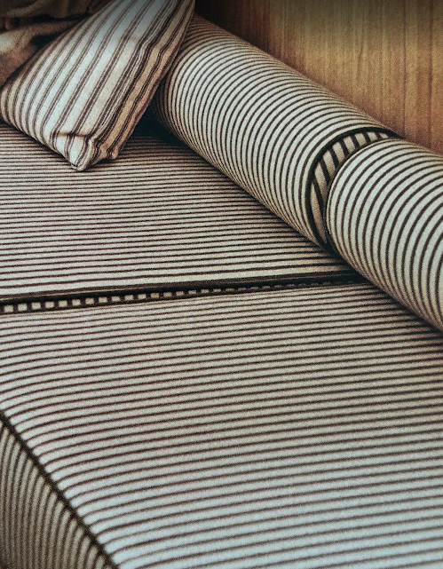 Hand-woven striped textile in warm earth tones